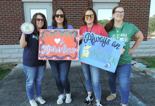 teachers with signs